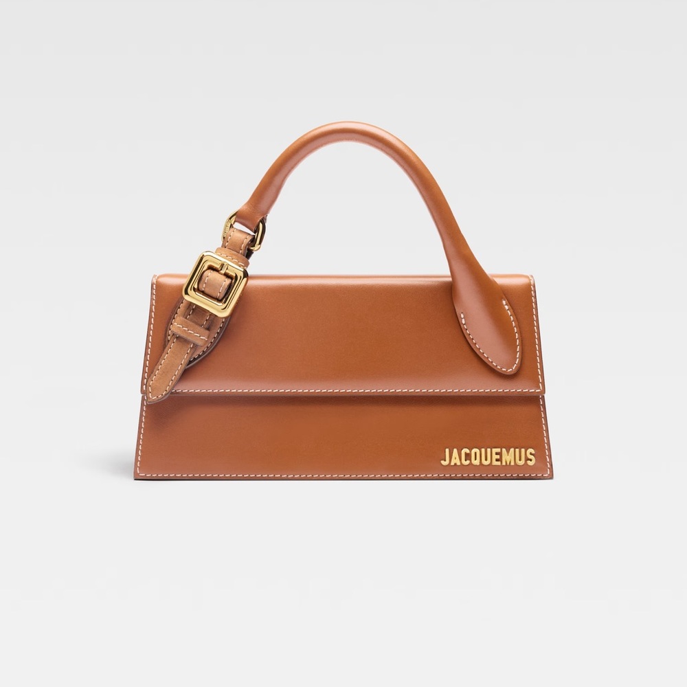 LE CHOUCHOU
Long signature buckled handbag.
